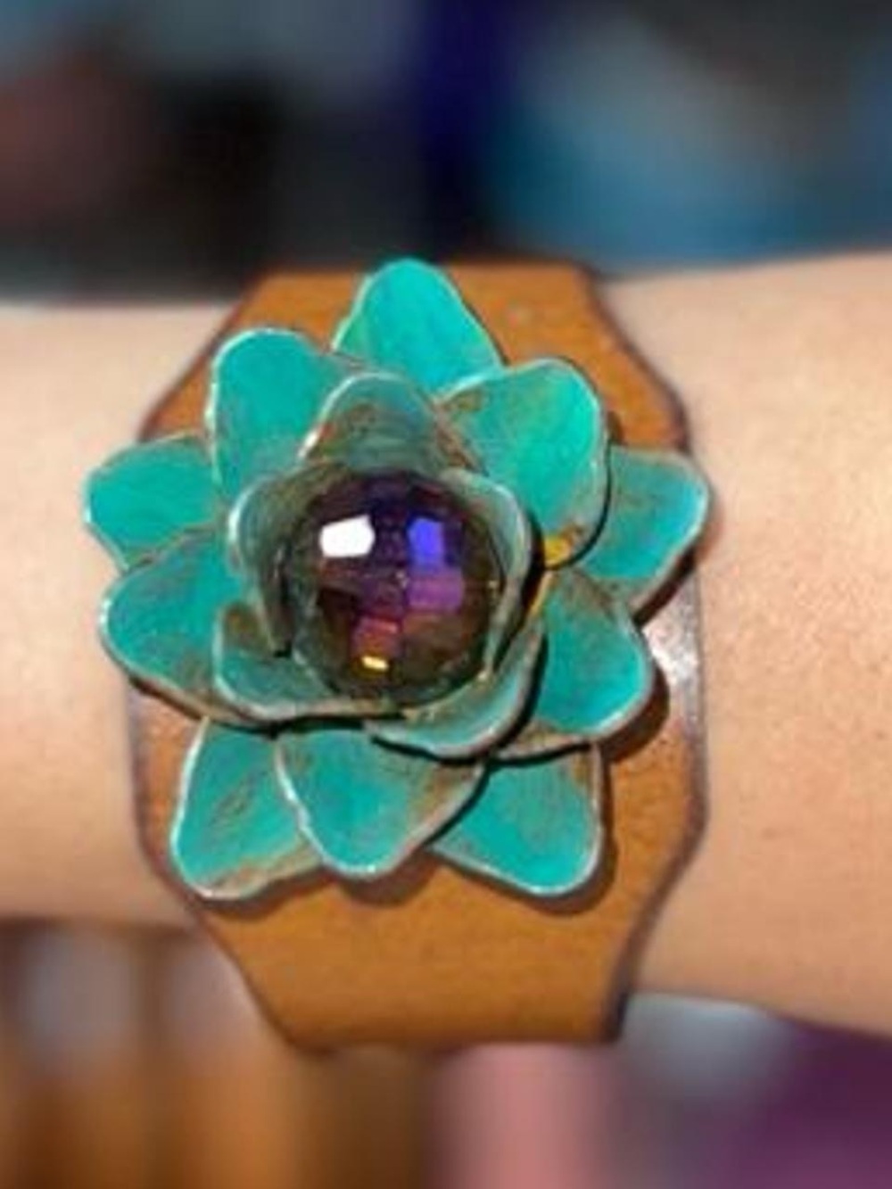 Handmade copper tone cuff with green flower and purple center jewel